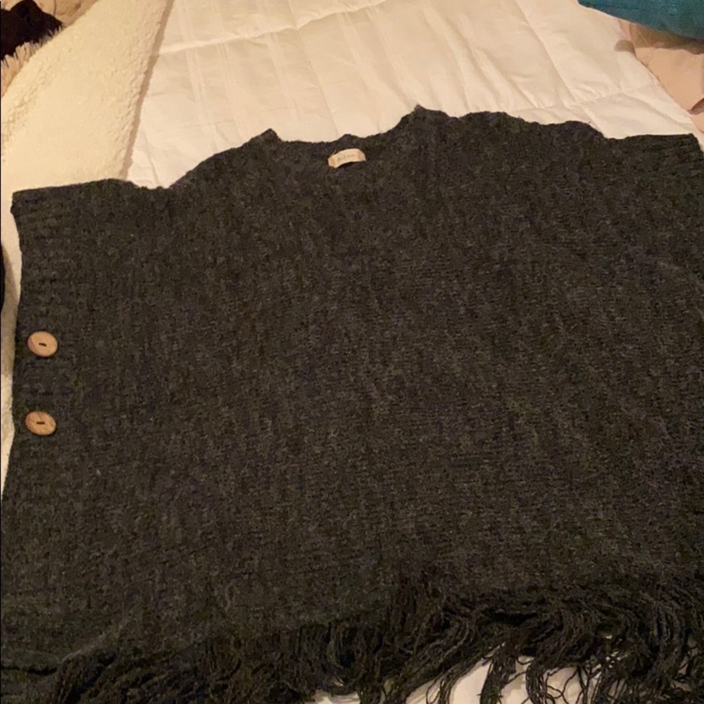 This is a sweater that is fringed at the bottom